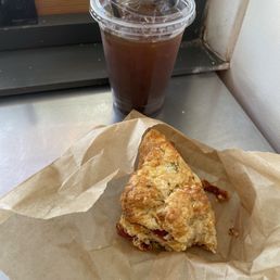 Iced coffee and a scone. I don't like scones. Bagels and croissants FTW. But it wasn't bad. Iced coffee and a scone. I don't like scones. Bagels and croissants FTW. But it wasn't bad.