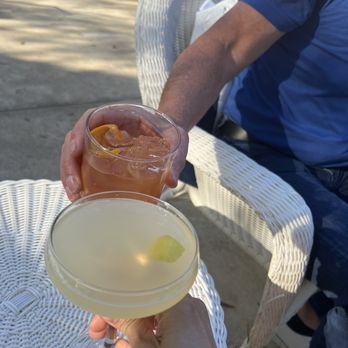Oak House Distillery - two people toasting with drinks - Distilleries Near Me - Athens, Georgia Oak House Distillery - two people toasting with drinks - Distilleries Near Me - Athens, Georgia