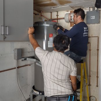 Roy's Plumbing - Two technicians working efficiently together. - Plumbing Near Me