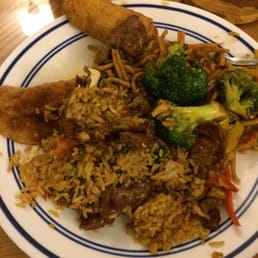 Fried dumpling on the left, egg roll at the top, and lo mein, beef broccoli, and fried rice mixed together. Fried dumpling on the left, egg roll at the top, and lo mein, beef broccoli, and fried rice mixed together.