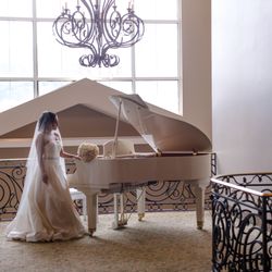 A moment as grand as the piano beside her.