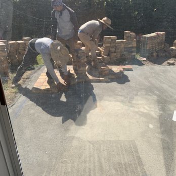 Signature Specialty Contractors - two men building a brick wall - General Contractors Near Me - Riverview, Florida Signature Specialty Contractors - two men building a brick wall - General Contractors Near Me - Riverview, Florida