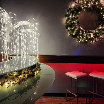 Chasers - a lighted bar with a wreath on the wall - Gay Bars Near Me - Charlotte, North Carolina