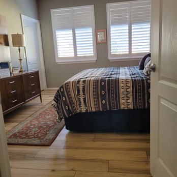 The Floor Store - a bedroom with a bed and dresser - Carpeting Near Me - Albuquerque, New Mexico