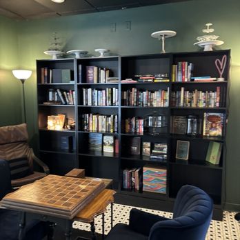 KAYSI CAKES - a living room with bookshelves and chairs - Desserts Near Me - DuBois, Pennsylvania