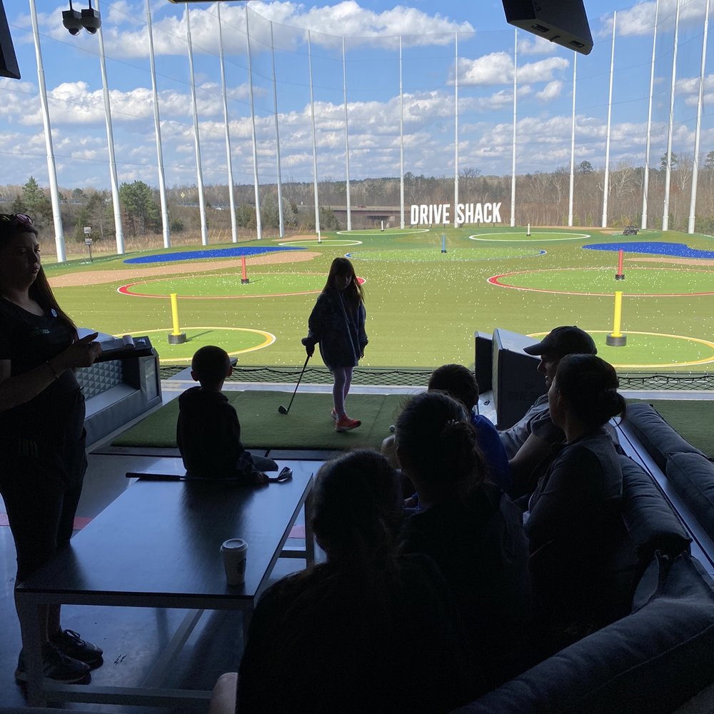 Drive Shack - Bay Area with table, couch & hitting mat - Golf Near Me - Richmond, Virginia Drive Shack - Bay Area with table, couch & hitting mat - Golf Near Me - Richmond, Virginia