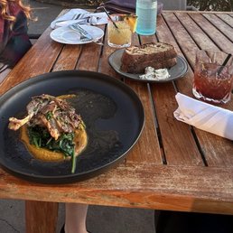 Duck Confit with Companion grilled bread, Pineapple margarita and old Fashioned. Duck Confit with Companion grilled bread, Pineapple margarita and old Fashioned.