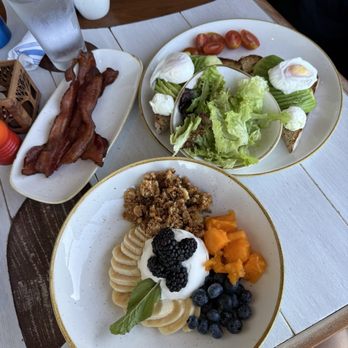 Monkeypod Kitchen - Breakfast - yogurt bowl and avocado toast w poached eggs - Tacos Near Me - Honolulu, Hawaii Monkeypod Kitchen - Breakfast - yogurt bowl and avocado toast w poached eggs - Tacos Near Me - Honolulu, Hawaii