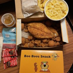 Yogi Bear's Honey Fried Chicken - Inside the seafood platter box. Sides are Mac & Cheese and fries.
