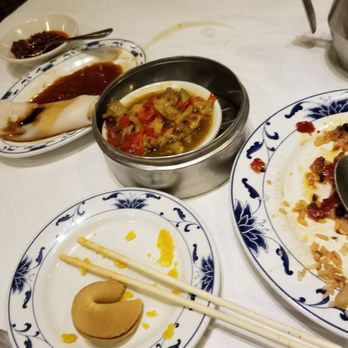 Grand Oriental - plates of food on a table with chopsticks - Dim Sum Near Me - Cincinnati, Ohio
