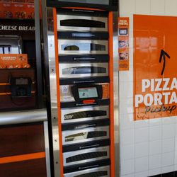 Little Caesars Pizza - Use app and pick up inside from machine.