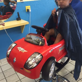 Kinder Cuts - Car facing big screen tv the new dinosaurs movie playing...stylist Kim is very good - Hair Salons Near Me - San Jose, California Kinder Cuts - Car facing big screen tv the new dinosaurs movie playing...stylist Kim is very good - Hair Salons Near Me - San Jose, California