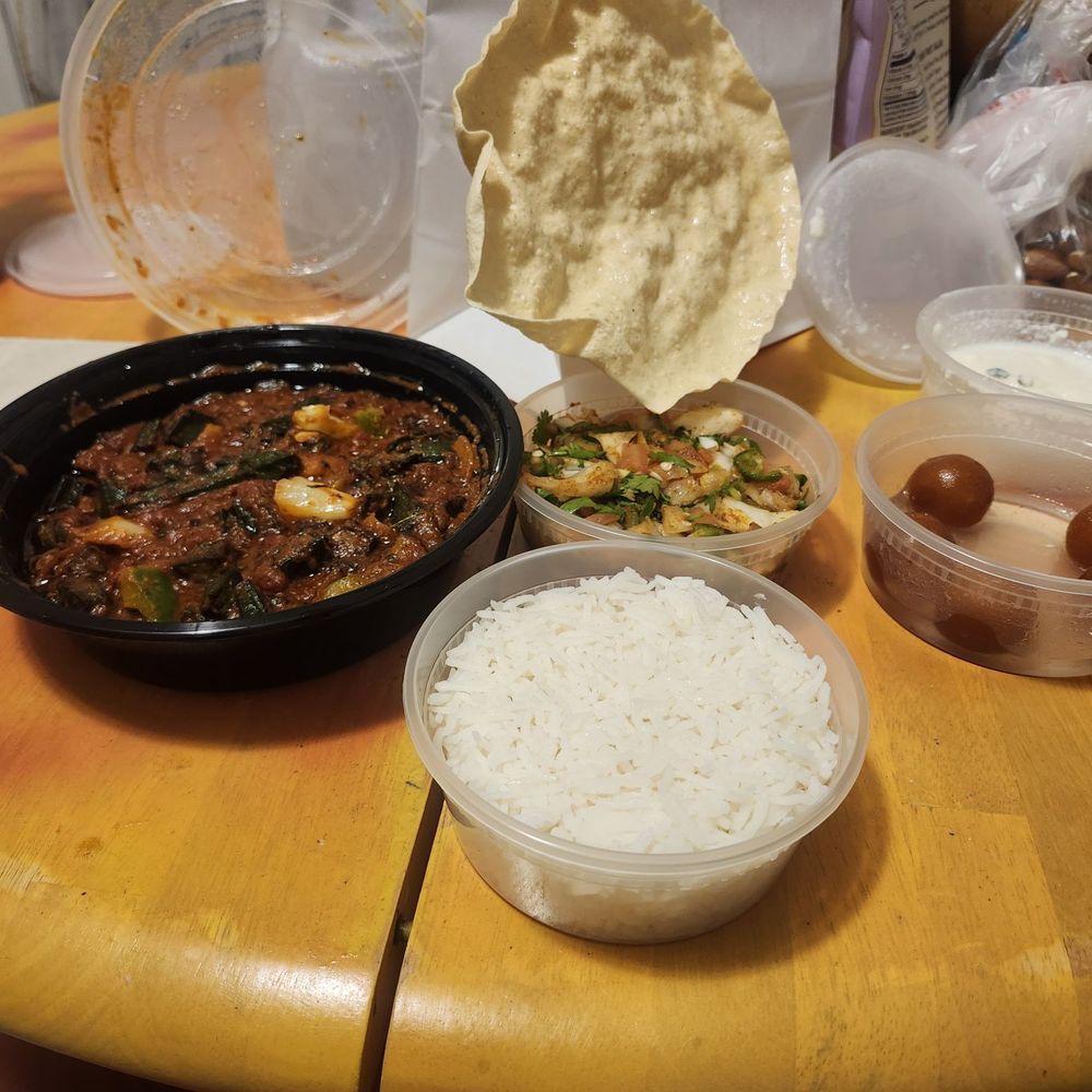 Udupi Indian Vegetarian & Vegan Cuisine - Bhindi Masala, White rice, Masala Pappad, Gulab Jamun, Rasamalai. Yea, messy table, items listed are in containers set for display. - Indian Near Me - Tempe, Arizona Udupi Indian Vegetarian & Vegan Cuisine - Bhindi Masala, White rice, Masala Pappad, Gulab Jamun, Rasamalai. Yea, messy table, items listed are in containers set for display. - Indian Near Me - Tempe, Arizona