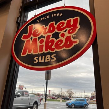 Jersey Mike's Subs - Logo sign and a slice of the view of the parking lot. - Fast Food Near Me - Conway, Arkansas