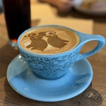 Big Island Coffee Roasters - Pandan latte and in the back a nitro cold brew. - Coffee Roasteries Near Me - Hilo, Hawaii Big Island Coffee Roasters - Pandan latte and in the back a nitro cold brew. - Coffee Roasteries Near Me - Hilo, Hawaii