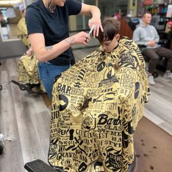 Oakway BarberShop - Myranda giving a haircut her 1st week.