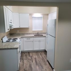 Pines Resort and Apartments by Asset Living - New cabinets, appliances and granite countertops.