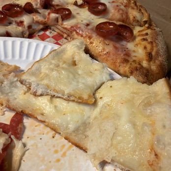 Sun City Slice - Eastlake - Dough under cooked on paper plate. - Pizza Near Me - El Paso, Texas