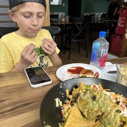 My son devouring some of the best food we've ever had. My son devouring some of the best food we've ever had.