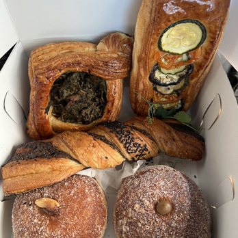 Wallflour Bake Shop - Ratatouille flat, pork luau danish, black sesame twist, Manoa chocolate and peanut butter donut, and Vietnamese coffee donut. - Bakeries Near Me - Honolulu, Hawaii