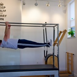 June Hines Pilates Studio - Jenkintown - Greg Elwell performing the pull up on the Cadillac
