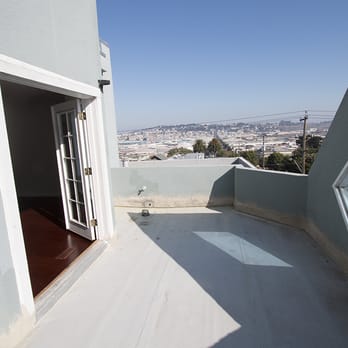 Eco Smart Roofer - a balcony with a view of the city - Roofing Near Me - San Francisco, California Eco Smart Roofer - a balcony with a view of the city - Roofing Near Me - San Francisco, California