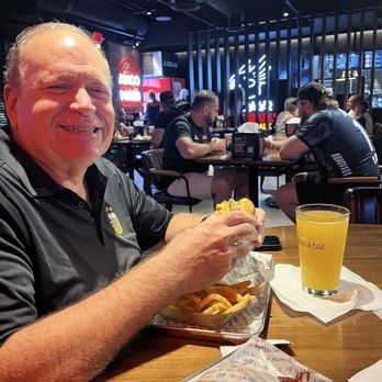 La Birra Bar - Enjoying a burger - Burgers Near Me - Oakland Park, Florida