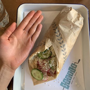 Souvla - lamb gyro wrap (hand for scale) - Greek Near Me - San Francisco, California Souvla - lamb gyro wrap (hand for scale) - Greek Near Me - San Francisco, California