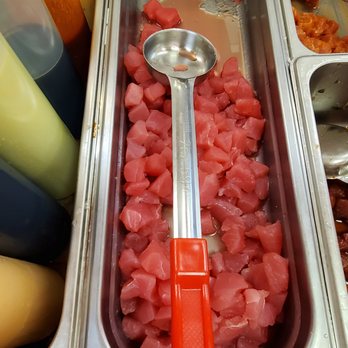Poke Star- Clemson - a spoon in a container of meat - Poke Near Me - Clemson, South Carolina Poke Star- Clemson - a spoon in a container of meat - Poke Near Me - Clemson, South Carolina