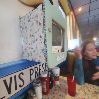 Flashback Breakfast & Lunch - a woman sitting at a table in front of a microwave - Breakfast & Brunch Near Me - Barrie, Ontario