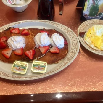 Another Broken Egg Cafe - Berry Pancake Trio with andouille sausage and fried eggs. SOOOO good with that warm syrup! - Breakfast & Brunch Near Me - Pembroke Pines, Florida Another Broken Egg Cafe - Berry Pancake Trio with andouille sausage and fried eggs. SOOOO good with that warm syrup! - Breakfast & Brunch Near Me - Pembroke Pines, Florida