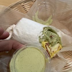 Smoothie Spot -  West Kendall - Egg wrap but you get more wrap than egg. Yes I know the sauce cup looks huge next to it because that how small and thin this wrap was.