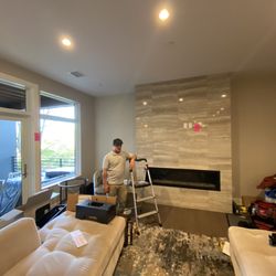 A/V Multimedia Solutions - Before: New construction condo Ann Arbor, third floor. Marble fireplace. What size TV do you think belongs here?