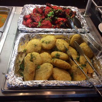 Curries - These potato cakes are amazing!! Chicken tiki was also very soft - Indian Near Me - Everett, Washington