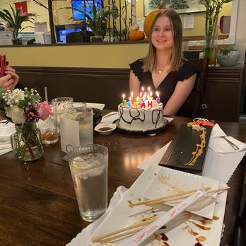 Asahi Sushi - Birthday girl, cake  and floral arrangement - Sushi Bars Near Me - Olympia, Washington