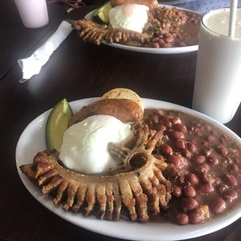 ArePA George - Bandeja Paisa (pork, beans, meat, chorizo, arepa, rice & an egg to top it off and avocado on the side - Colombian Near Me - Chicago, Illinois ArePA George - Bandeja Paisa (pork, beans, meat, chorizo, arepa, rice & an egg to top it off and avocado on the side - Colombian Near Me - Chicago, Illinois