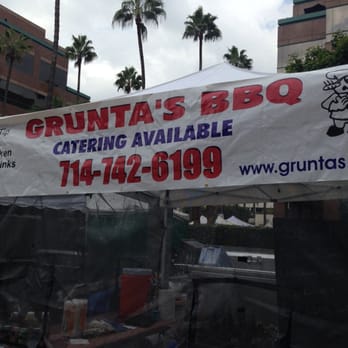 Grunta's BBQ - a tent set up for a bbq - Street Vendors Near Me