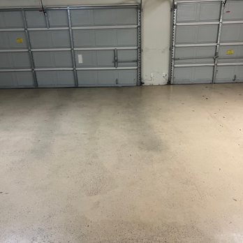 FLORES FLOORING - This is the before picture of our garage. - Tiling Near Me