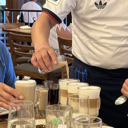 La Veranda - Waiter turning a cappuccino in to an Irish coffee