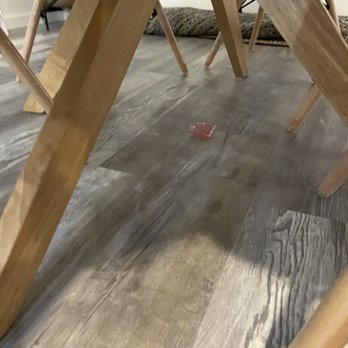 Kleanology - Some sort of trash/plastic on the floor under the table - Office Cleaning Near Me