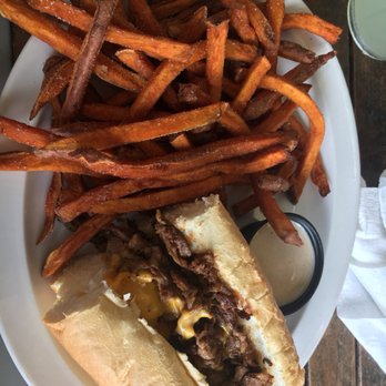 Thirsty Fellow - Philly Cheesesteak with sweet potato fries - American Near Me - Columbia, South Carolina Thirsty Fellow - Philly Cheesesteak with sweet potato fries - American Near Me - Columbia, South Carolina