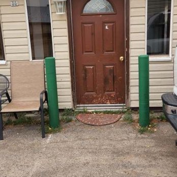 Dancing Bears Inn - Smoking chair right outside out door and right where people park. - Hotels Near Me - East Glacier Park, Montana