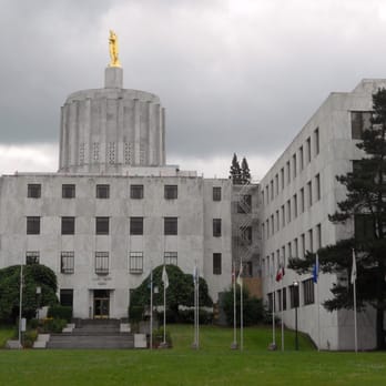 Oregon State Capitol - West side where you'll find the Walk of Flags and a Fountain as part of adjacent State Capitol State Park.  June weather. :-) - Landmarks & Historical Buildings Near Me - Salem, Oregon