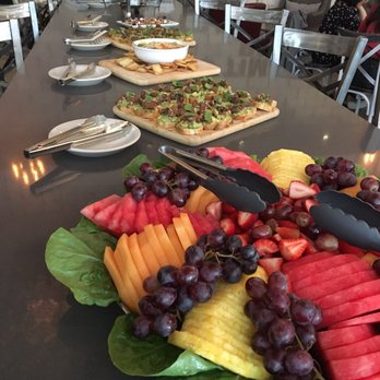 Cellar 7 - Delicious brunch spread:  pastas, flat breads, spinach artichoke dip, tuna, fruit tray, etc. - American Near Me - Houston, Texas
