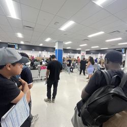 Department of Motor Vehicles - Every single chair filled, people standing everywhere