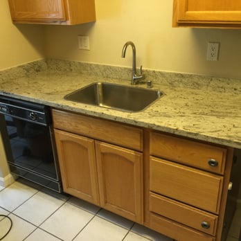Burfine - a kitchen with granite counter tops - Flooring Near Me Burfine - a kitchen with granite counter tops - Flooring Near Me