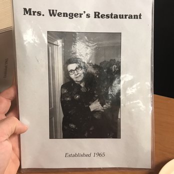 Mrs Wengers Restaurant - a person holding a book - American Near Me - Sanford, North Carolina Mrs Wengers Restaurant - a person holding a book - American Near Me - Sanford, North Carolina