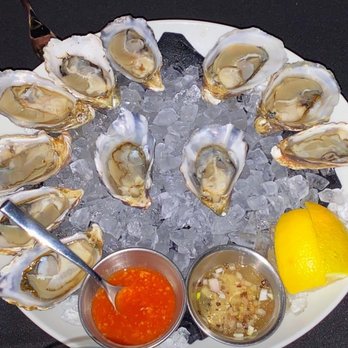 The Butcher's Table - Oysters served with a champagne mignonette - Steakhouses Near Me - Seattle, Washington The Butcher's Table - Oysters served with a champagne mignonette - Steakhouses Near Me - Seattle, Washington