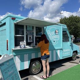 a woman ordering from a food truck