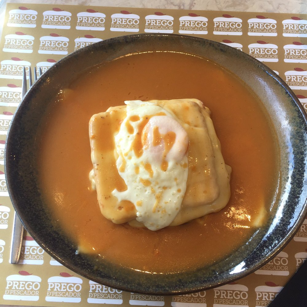 I had the 'Francesinha' which I'm told is a speciality from Porto. It's got many layers of cheese, meat, sausage and topped with an egg! I had the 'Francesinha' which I'm told is a speciality from Porto. It's got many layers of cheese, meat, sausage and topped with an egg!